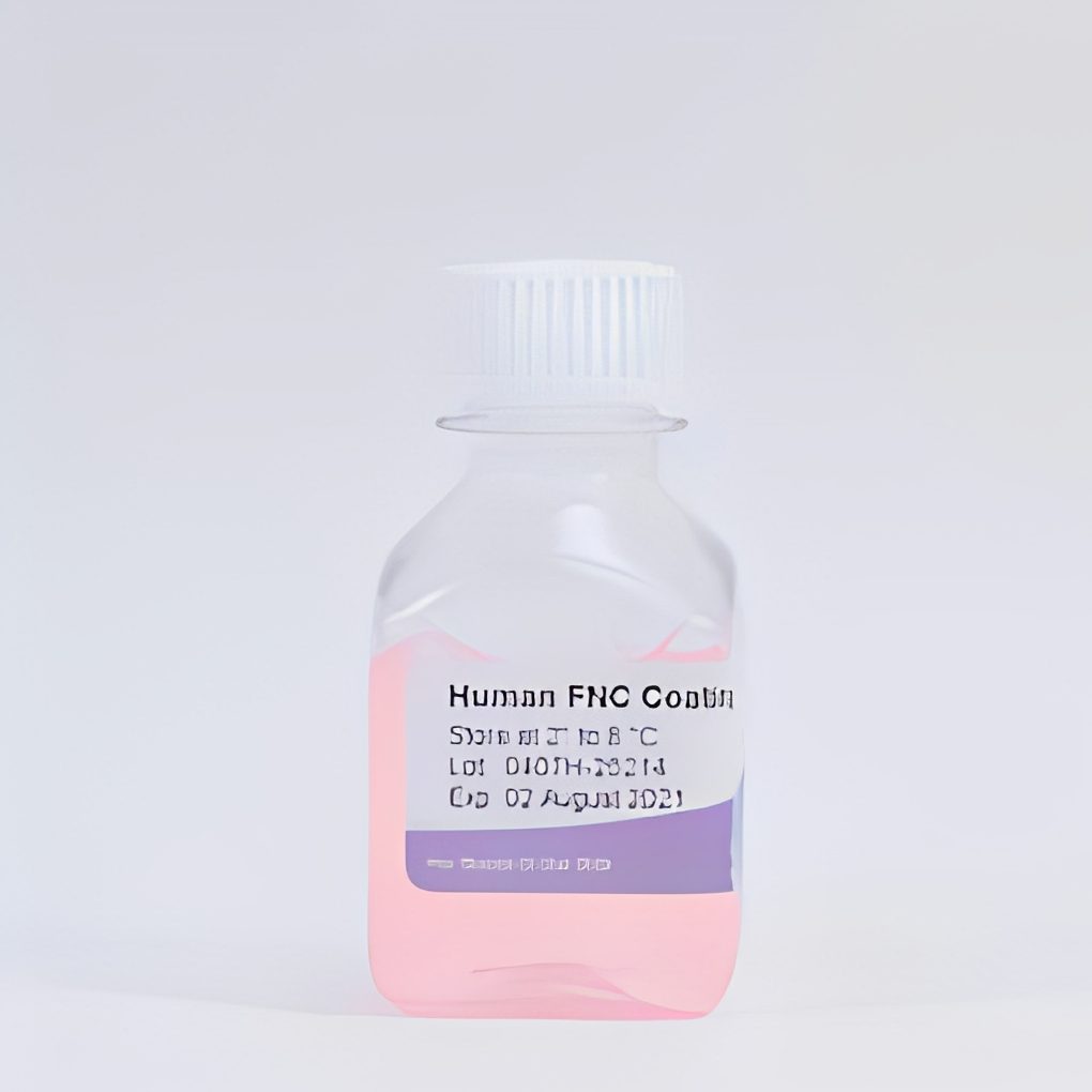 Pink liquid in labeled bottle.